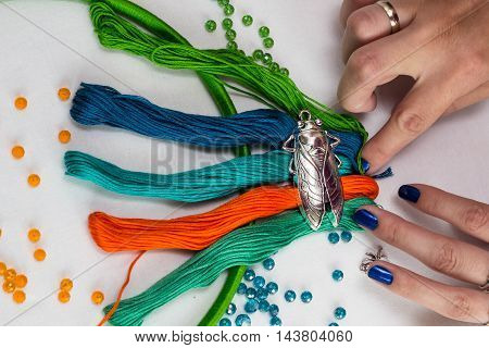 set for making a Dreamcatcher beads thread on a white background