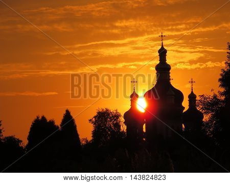 The building of the Orthodox Church against the setting sun