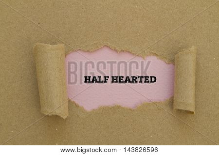 HALF HEARTED word written under torn paper.