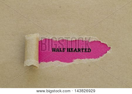 HALF HEARTED word written under torn paper.