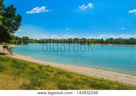 Beach on beautiful Jarun lake in Zagreb, Croatia, sunny summer day
