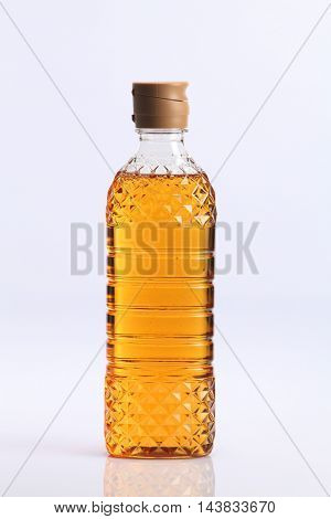 bottle of the apple oligo syrup on the white background