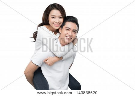 Copy-spaced portrait of a young couple in-love smiling and looking at camera