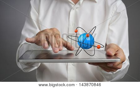 Man scientist holding a tablet PC with atom model, research concept