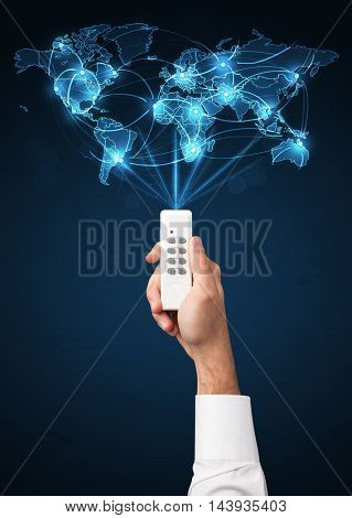 Glowing social network  world map coming out of a remote control
