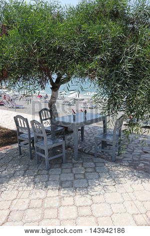 31ST JULY 2016, CALIS,TURKEY; A seating area of table and chairs along calis beach in turkey, 31st july 2016
