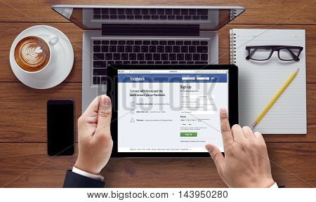 Bangkok, Thailand - Mar 10, 2015: Man On A Ipad  Browsing Facebook