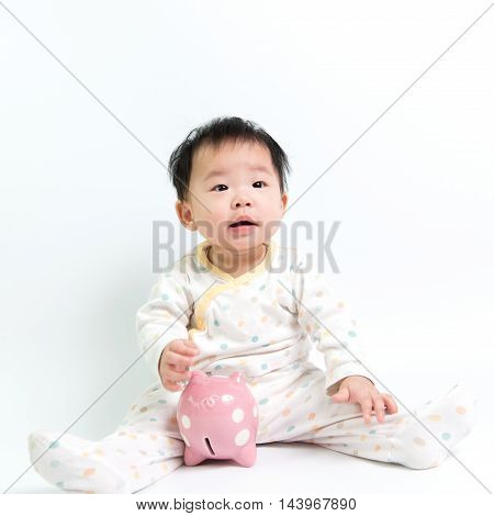 Asian Baby With Piggy Bank