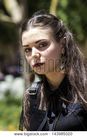 CAGLIARI, ITALY - May 29, 2016: Sunday at La Grande Jatte VIII Ed. At the Public Gardens - Sardinia - portrait of a beautiful girl in Victorian costumes