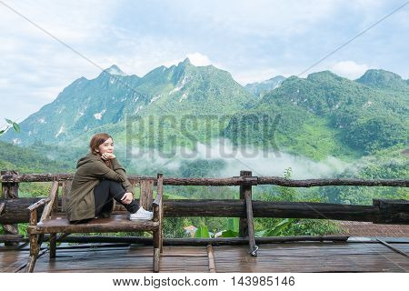 Smiling Young Woman With  Montains Background ( Chiang Mai Province, Thailand )