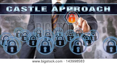 Security professional is touching CASTLE APPROACH on an interactive control screen. Computer network security information assurance and data protection concept for defense in depth.