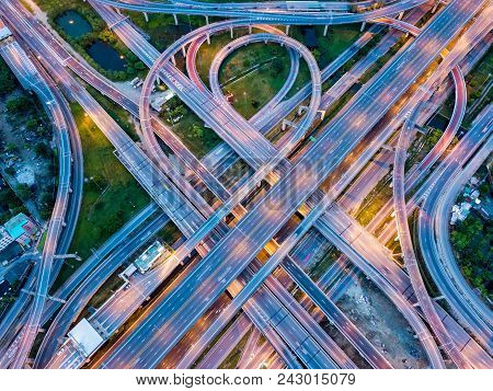 Top View Of Highway Road Junctions At Night. The Intersecting Freeway Road Overpass The Eastern Oute
