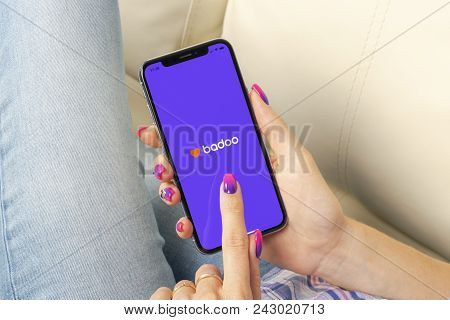Sankt-petersburg, Russia, May 30, 2018: Badoo Application Icon On Apple Iphone X Screen In Woman Han