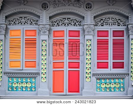 Vintage Singapore Straits Chinese Or Peranakan Shop House With Antique Orange And Red Wooden Shutter