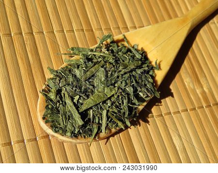 Sencha Green Tea On The Wooden Spoon. Dried Tea Leaves