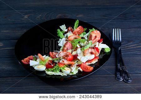 Fresh Salad From Different Vegetables And Tasty Shrimps In A Plate On The Table
