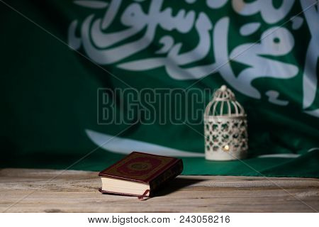 Sacred Book Of Koran On A Wooden Surface