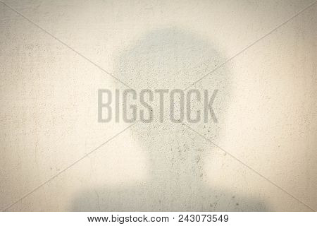 Shadow Of Human Head On Abstract Wall