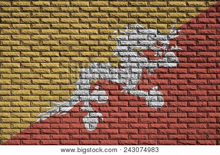 Bhutan Flag Is Painted Onto An Old Brick Wall