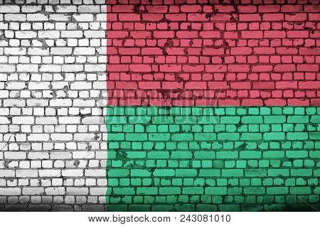 Madagascar Flag Is Painted Onto An Old Brick Wall