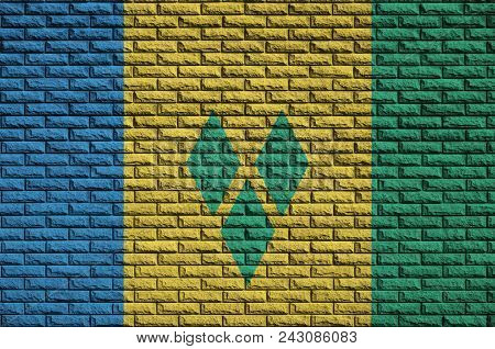 Saint Vincent And The Grenadines Flag Is Painted Onto An Old Brick Wall