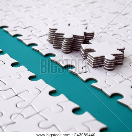 The Blue Path Is Laid On The Platform Of A White Folded Jigsaw Puzzle. The Missing Elements Of The P