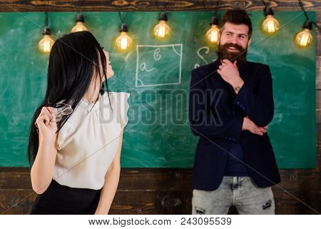 Lady Teacher And Bearded Hipster Schoolmaster Working Together In School. Generation Concept. Man Wi