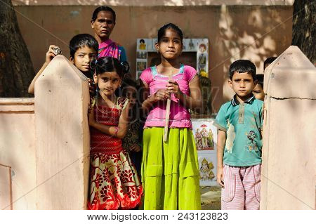 Group Of Indian Poor Kids With Mother Looking At Camera 11 February 2018 Puttaparthi, India