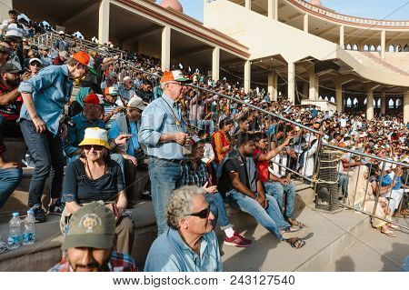 26 February 2018 Amritsar, India. Crowd Of White European Tourists At India Pakistan Wagah Border Sh