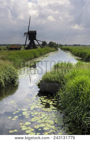 View Of The Scheijwijk Mill Near Hoornaar With An Approaching Thunderstorm In The Background
