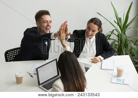 Excited Millennial Office Team Giving High Five Together, Business People Celebrating Good Teamwork 