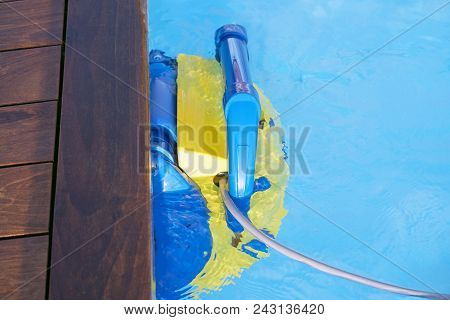 Pool Cleaner During His Work. Cleaning Robot For Cleaning The Botton Of Swimming Pools.