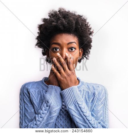 Spellbound woman covering her mouth
