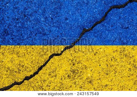 Flag Of Ukraine Painted On Cracked Wall Background/ukrainian Civil War Concept