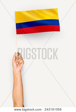 Person waving the flag of Republic of Colombia