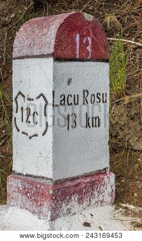 Concrete Road Sign To Lacu Rosu In Romania