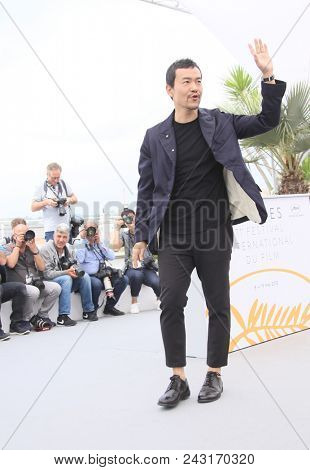 Liao Fan attends the photocall for 'Ash Is The Purest White (Jiang Hu Er Nv)' during the 71st annual Cannes Film Festival at Palais des Festivals on May 12, 2018 in Cannes, France. 