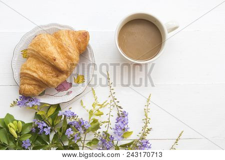 Hot Coffee With Dessert Snack And Flower On Background White Wooden