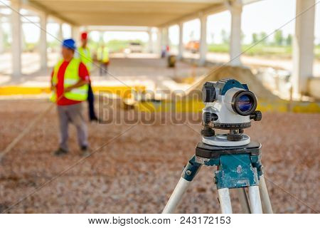 Surveyor Instrument Is For Measuring Level On Construction Site. Surveyors Ensure Precise Measuremen