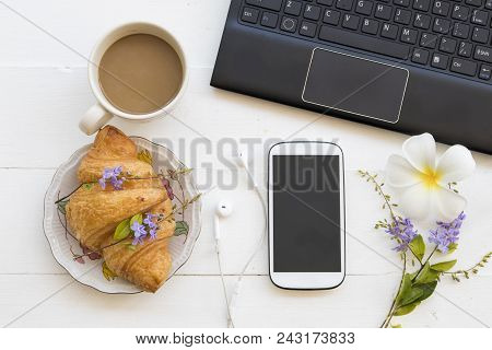 Computer Notebook Mobile Phone For Business And Dessert Bakery ,hot Coffee On Table White At Office 