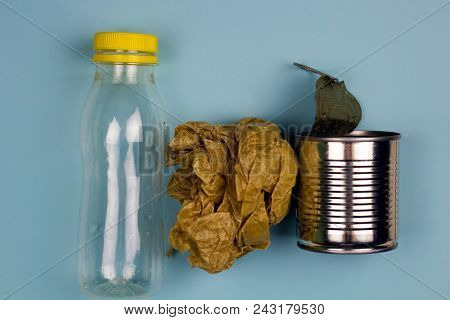 Top View Bottle, Paper And Can Blue Background