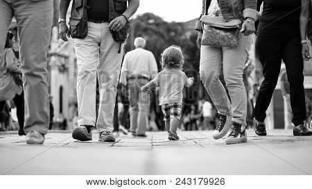 Kids Playing - Happy Game. Photo Back View Of Cute Fair-haired Blond Kid Tiny Little Child Baby Boy 