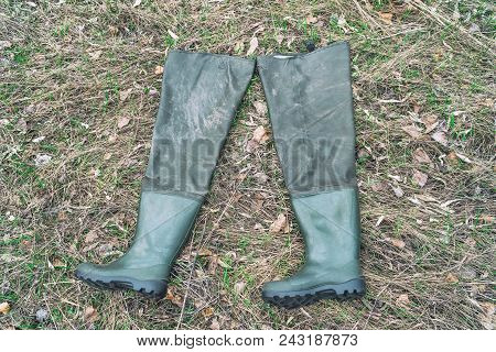 Boots For Fishing On Dry Grass. Fishing Wellingtons