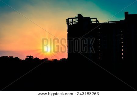 Silhouette Of Construction Site At Sunset- Cityscape