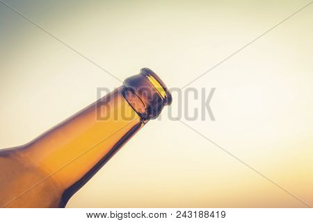 Empty Yellow Beer Bottle On Isolated Background