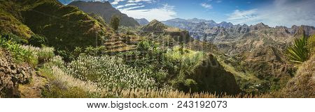 Gorgeous Panorama View Of Huge Barren Mountain Peaks, Cliff And Canyons Of Dry Arid Desert Landscape