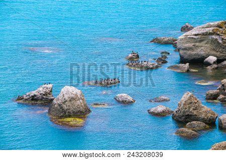 Beautiful Sea With Blue Calm Water And Rocks Landscape. Tourism Concept.