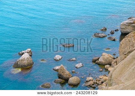Beautiful Sea With Blue Calm Water And Rocks Landscape. Tourism Concept.