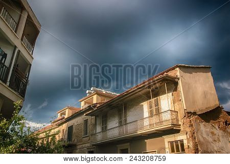 Detail Of An Abandoned Building In Cloudy Sky Landscape