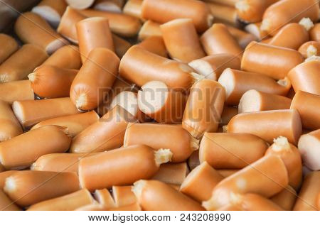 Suasages Cut In Half On The Tray